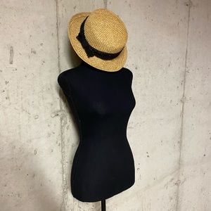 Straw hat with black band.